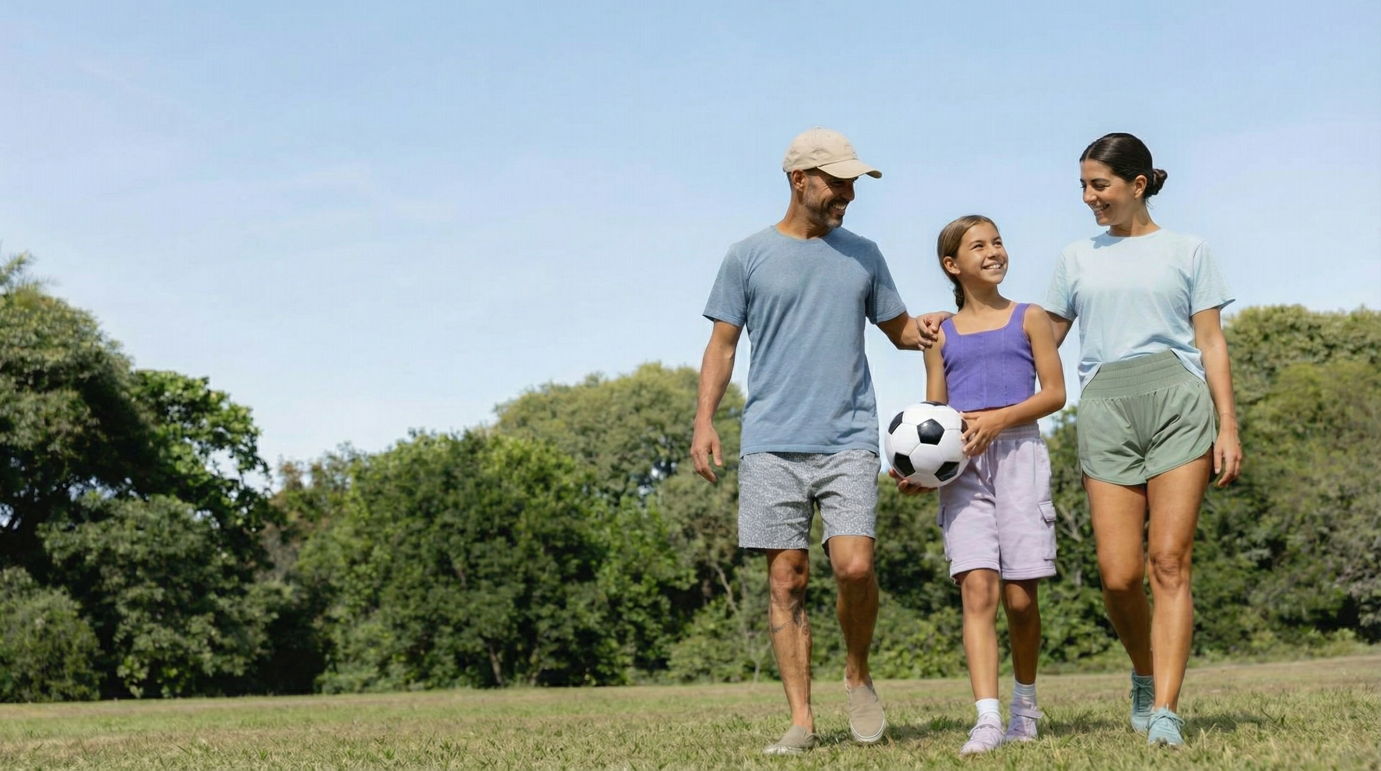 Happy family walking outdoors in peak health